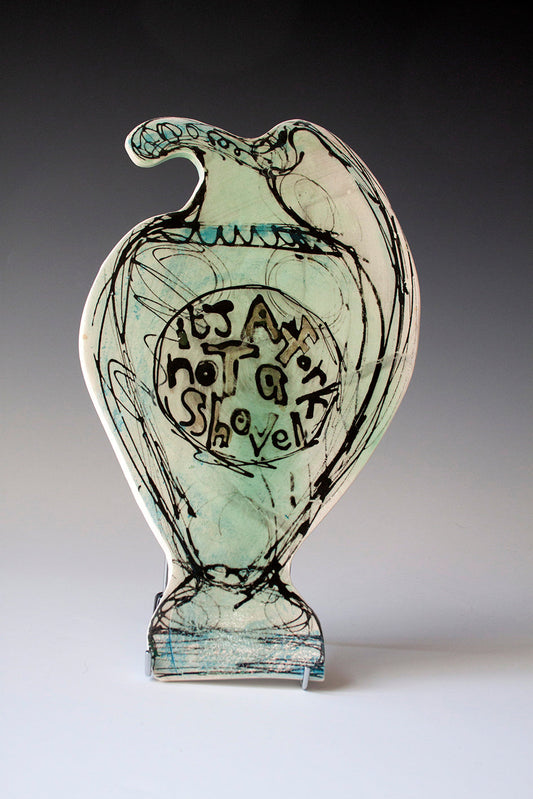 It's a Fork Not a Shovel by Kim Stuttard — mono print and glaze on ceramic tile. attachment fitted on the back so the piece can be hung directly onto the wall. (34 × 19.5 cm)